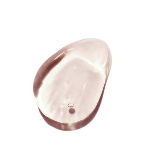 Rose gold oval-shaped object on a white background